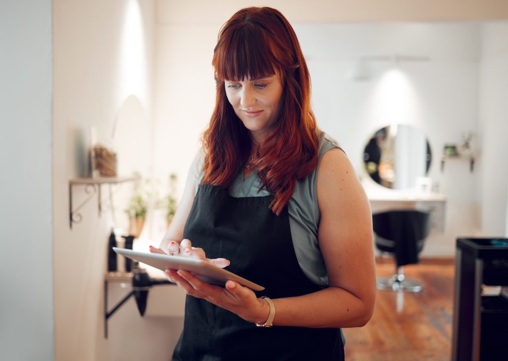 Woman, digital tablet and salon schedule for small business calendar, internet booking or customer