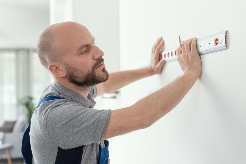 Handyman using a bubble level